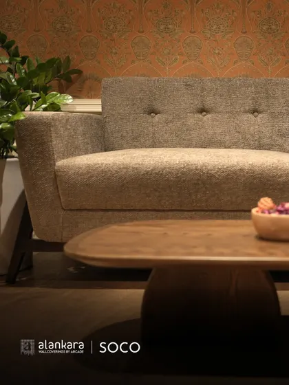 A detail shot of the Soco sofa, showing the subtle button-tufting on the backrest which adds a touch of classic detail to its modern frame.