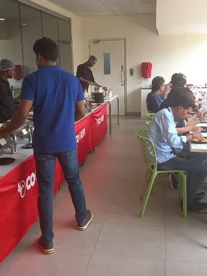 Employees lining up for a satisfying hot lunch provided by our catering team. We manage the entire food service so you can focus on your event.
