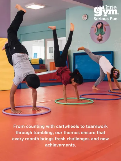 Students practice cartwheels in hula hoops, an activity from our "Fun is Number 1" theme. This drill combines tumbling with spatial awareness, making learning fresh and challenging.