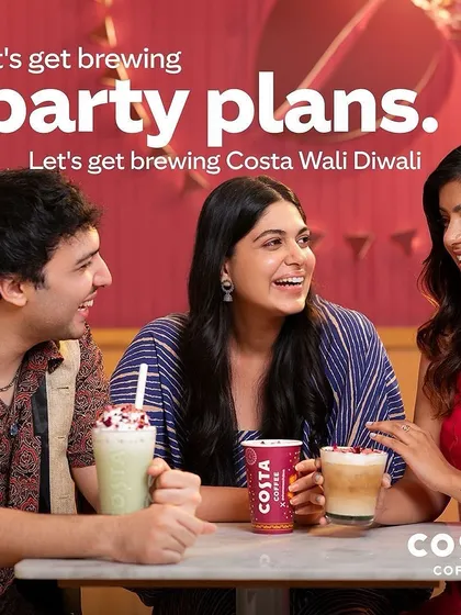 This image from the Costa campaign focuses on a group of friends making plans. The wardrobe for each person was carefully selected to reflect their individual style while creating a harmonious group picture.