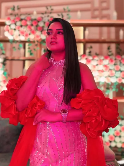 The red and beige gown under different lighting. The color and shimmer adapt beautifully to any event's ambiance.