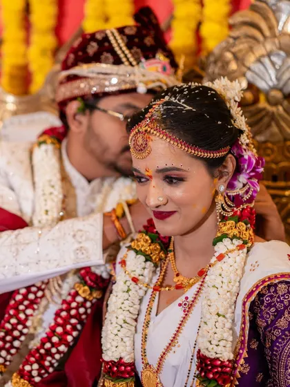 A tender moment between the bride and groom during their wedding ceremony, capturing their love and affection.