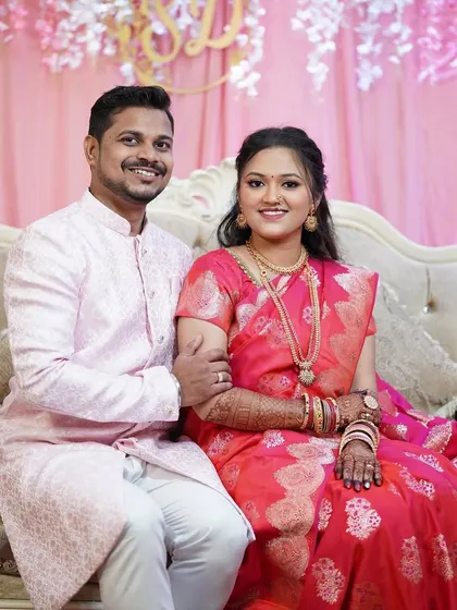The official Sakharpuda portrait. Both bride and groom look picture-perfect. I ensured the bride's makeup was radiant and complemented her partner's attire.