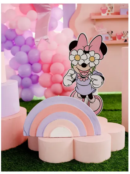 Another view of the groovy Minnie Mouse prop and pastel rainbow, perfect for a fun and stylish birthday party.
