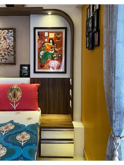 This detail shot highlights the combination of textures and colors, from the client's vibrant art and textiles to the warm wood and neutral wall colors we selected.