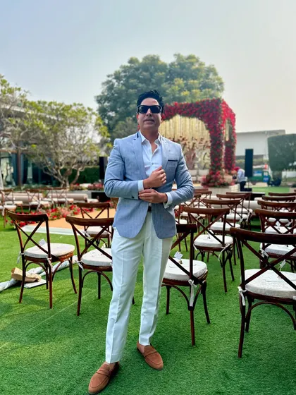 A moment before the guests arrive for an outdoor daytime wedding ceremony. The elegant setup on the lush green lawn provides a beautiful and serene backdrop for the event ahead.