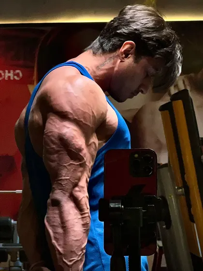 A close up on my forearm and bicep, a testament to the sacrifices made for my goals.