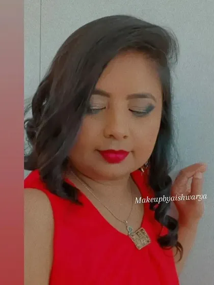 A classic party look with a bold red lip and a soft smokey eye. I paired this with gentle waves in the hair for a relaxed yet glamorous style.