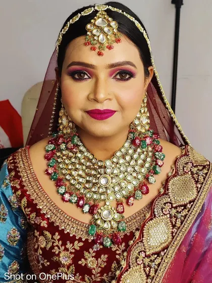 A full-face portrait of the bride, looking directly at the camera. Her confidence and the perfectly executed makeup show she is ready for her big day.