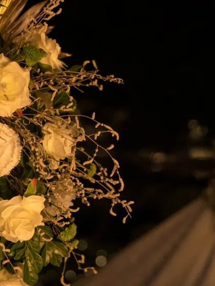 Detail of the white rose arrangements. I believe in using high quality floral designs to add a touch of classic elegance and romance to your milestone event.