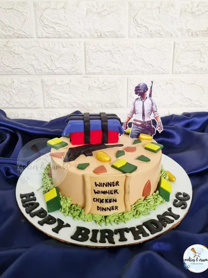 Winner Winner Chicken Dinner! A fun PUBG-themed cake for a gaming enthusiast, complete with an airdrop crate and other game elements.