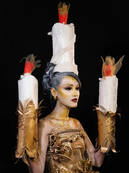 We encourage our students to push their creative limits with fantasy and SFX makeup. This stunning candle-inspired look demonstrates advanced techniques in body painting, prop integration, and character creation.