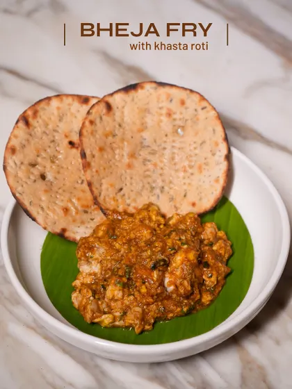 Bheja Fry, an iconic dish, served my way. It's earthy, hearty, and layered with masalas, paired perfectly with a crispy, flaky khasta roti.