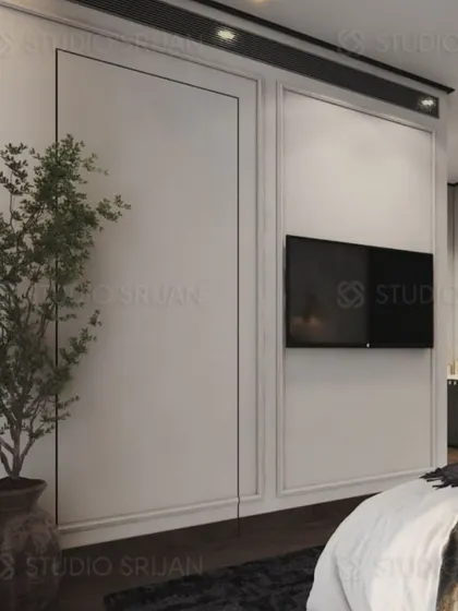 The TV wall is kept simple with classic wall molding, allowing the other design elements in the room to stand out.