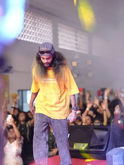 Walking the stage and engaging with the students in the front row, making the show personal and interactive.