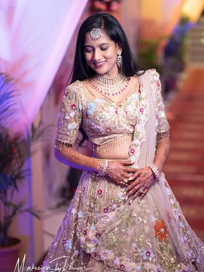 A full-length view of Jagruthi's stunning floral embroidered lehenga.