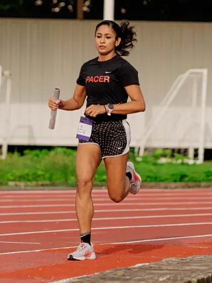Focused and driving forward during a relay race. This kind of intensity is built through months of dedicated training and a no-excuses mindset.