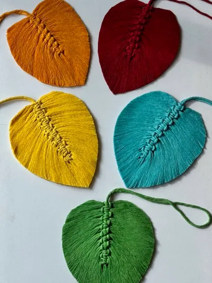 Macrame feathers in the making. These vibrant colors are sure to brighten your day.