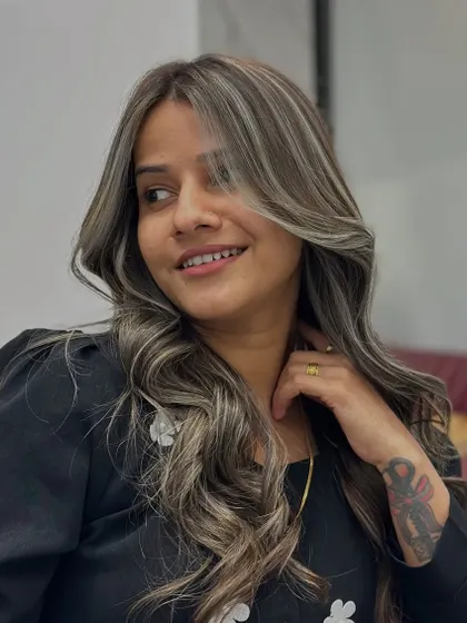 The joy and confidence that come with a new hair color are evident in this shot.