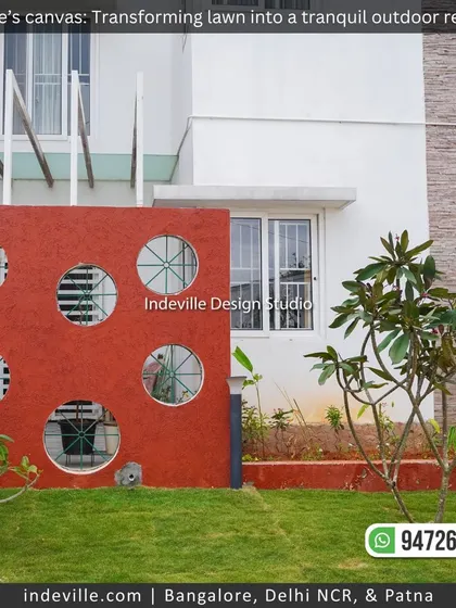 A duplicate image of the bold red accent wall, a key feature of this modern backyard.
