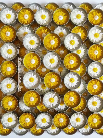 A beautiful, artistic shot of my daisy tin candles. The yellow and white flowers create a stunning visual pattern.