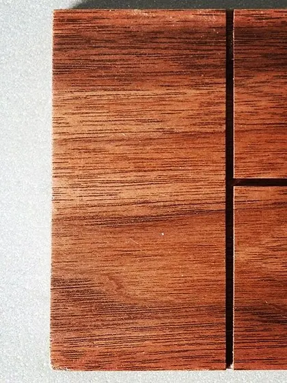 This detailed shot highlights the rich, deep color and grain of another of our custom wooden touch panels, perfect for homes with classic or contemporary wood finishes.