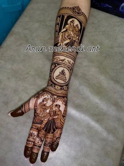 A single arm design featuring a varmala scene on the palm and a depiction of Shiv and Parvati on the forearm.