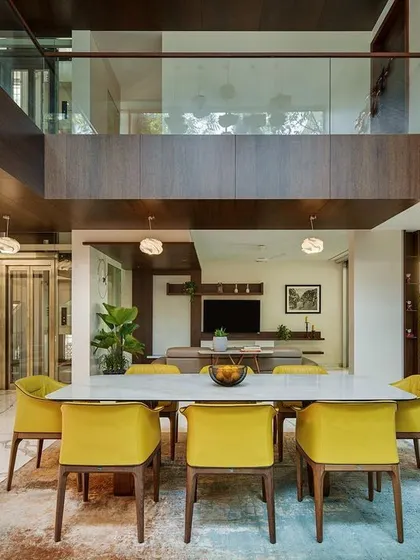The vertical connection in Kanasu is key. This view shows how the dining area is overlooked by the upper floor, enhancing the sense of volume and family connection.