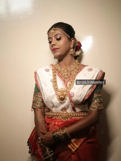 A model in a traditional Coorgi-style saree drape, complemented by my antique temple jewellery.