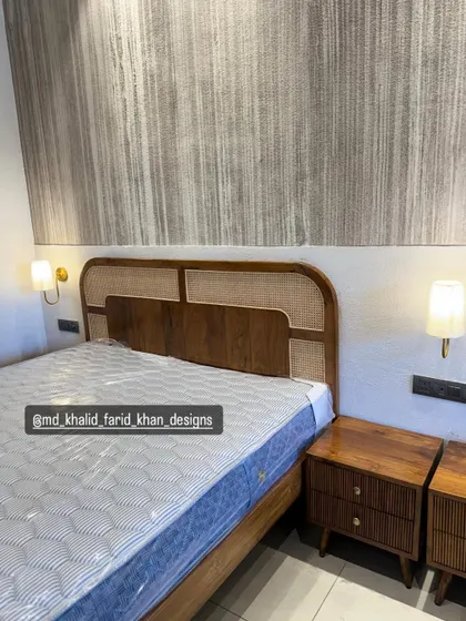 A detailed shot of the bed with a cane headboard, flanked by two different nightstand designs to show customization options.