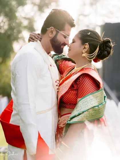 A romantic, sun-flared portrait of the couple, creating a dreamy and magical feel.