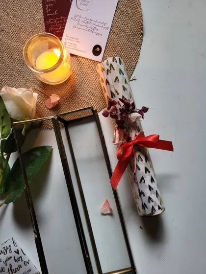 The glass box keeps the delicate scroll safe, turning a simple letter into a beautiful decorative piece.