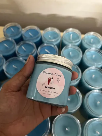 Custom candles for a Roka return favor. We can create personalized stickers with your hashtag, names, and date.
