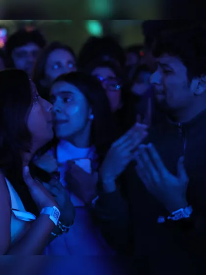 A candid moment of friendship and fun in the crowd. Our concerts are a place to connect and share unforgettable experiences.