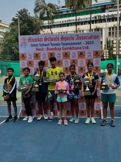 The winners of the Inter School Tennis Tournament 2024, hosted at Bombay Gymkhana, proudly displaying their trophies and medals.