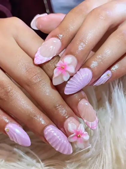 A full view of the mermaid-inspired 3D nail set. The combination of sculpted textures, 3D florals, and pastel lavender creates a truly unique and memorable manicure.