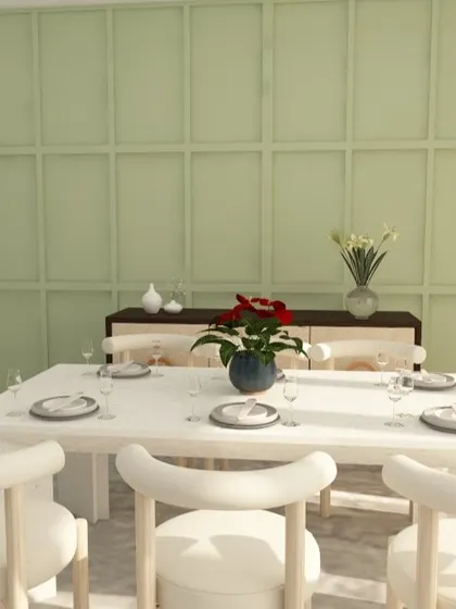 The dining area adjacent to the living room continues the fresh, airy theme. A light green paneled wall adds a subtle pop of color, while the white dining table and chairs keep the space feeling bright and open.
