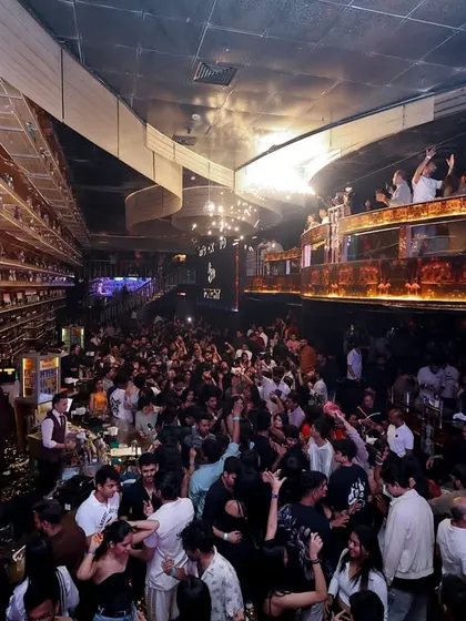 A wide shot of a completely packed Shiloh. From the ground floor to the balconies, the entire venue is part of the party.