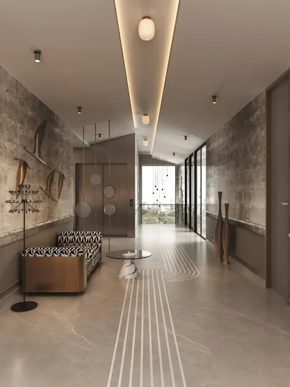 This hallway in our Ludhiana Villa project showcases quiet opulence. We used textured walls, intricate floor patterns, and sculptural art pieces to transform a transitional space into a designed experience, with gold details adding a touch of drama.