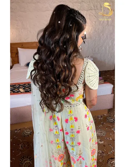 A side view of the mirror-accented hairstyle, showing a hint of braid detailing at the front.