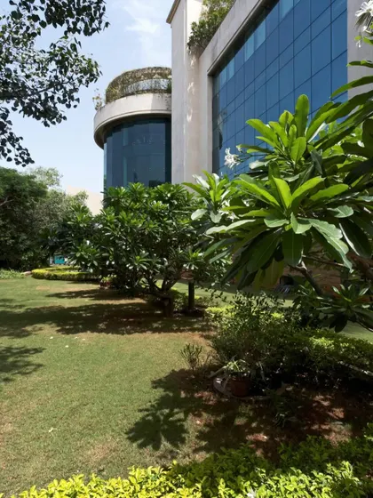 The landscaped grounds of Yashraj Studios in Mumbai. The design provides a green, tranquil environment that contrasts with the high-tech interiors, offering a space for creative minds to relax and collaborate.