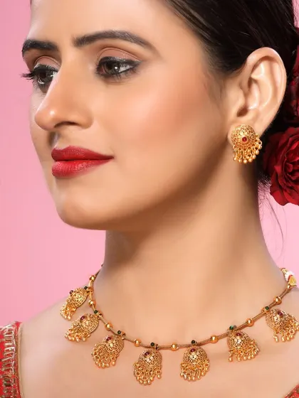 This image features a classic temple jewellery necklace with intricate mango-shaped motifs, perfect for a heritage collection.