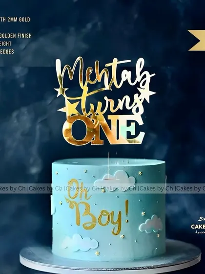 Celebrating a first birthday is so special. I created this sky-blue "Oh Boy!" cake for Mehtab's big day, complete with a custom "Mehtab turns ONE" topper in a glossy gold acrylic finish.