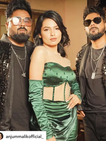A behind-the-scenes look from the song 'Koka'. I designed this glamorous party look featuring a custom emerald green satin dress with a sheer corset bodice and matching gloves for a bold, high-fashion statement.