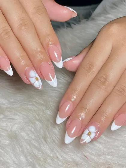 Classic almond-shaped French tips with a delicate touch. I added a simple 3D white flower with a gold stud at the center for a hint of floral elegance.