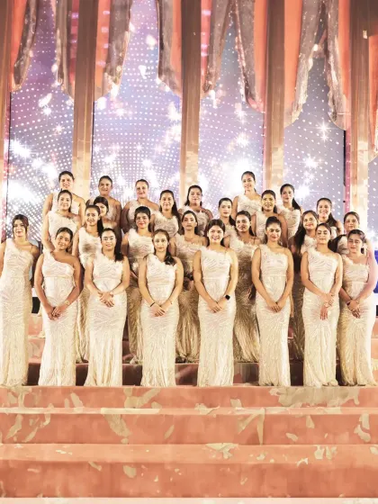 Our elegant female service staff, dressed in beautiful white gowns. Their grace and professionalism add a touch of sophistication and glamour to high-end events.