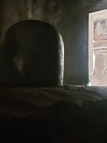 The sanctum at the Elephanta Caves. The play of light and shadow in these ancient, excavated spaces creates a profound sense of peace and mystery, sparking deep contemplation.