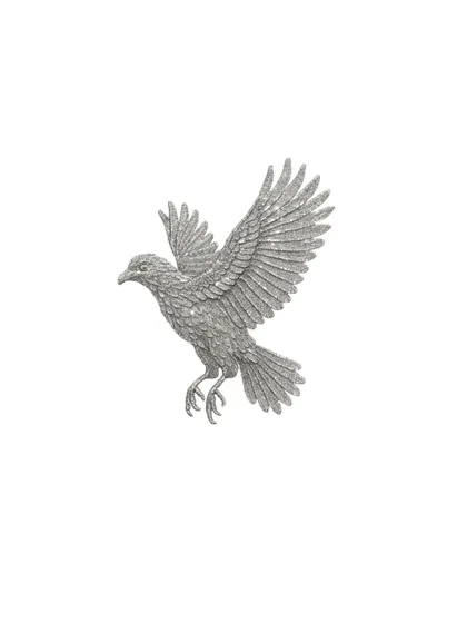 An isolated view of the hand-embellished bird motif. Each sequin is carefully placed to create a soaring silhouette, a symbol of freedom and elegance.