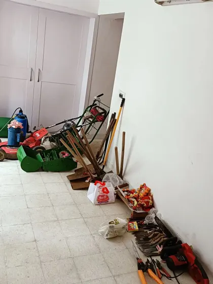 Our complete set of professional gardening tools, including lawnmowers, shears, and spades, all prepared for the annual Vishwakarma pooja. We invest in quality equipment to deliver quality work.