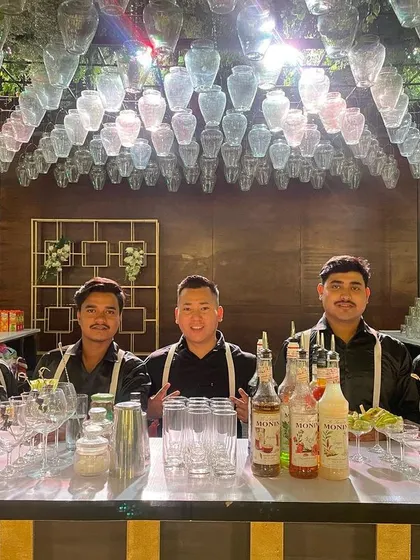 Our professional team ready for service at an elegant event. Dressed in classic black shirts and suspenders, we are prepared to deliver a top-tier bar experience.